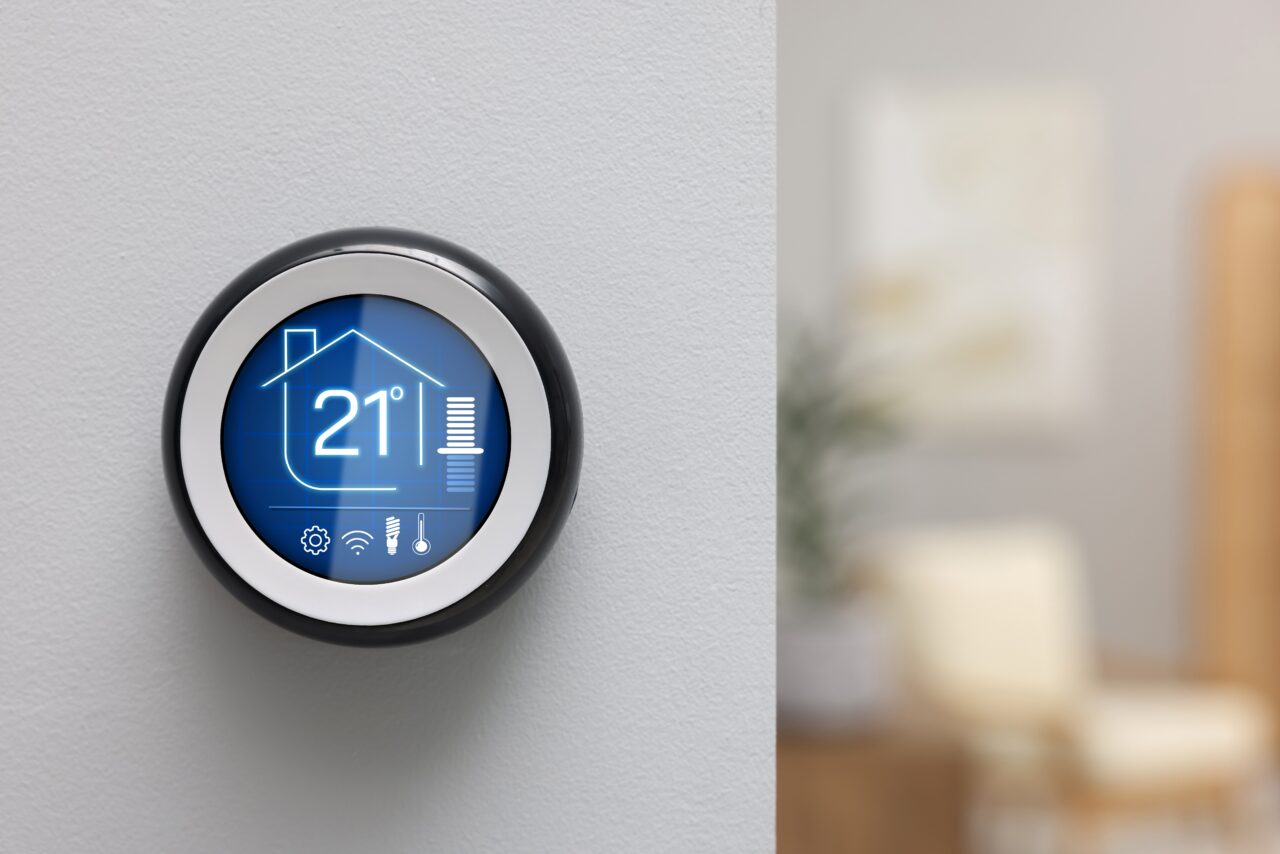 Thermostat displaying temperature in Celsius scale and different icons