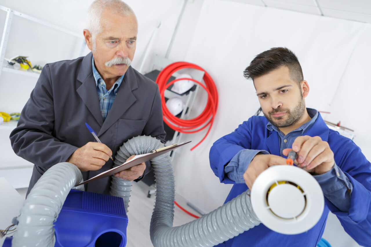 young apprentice technician with his instructor
