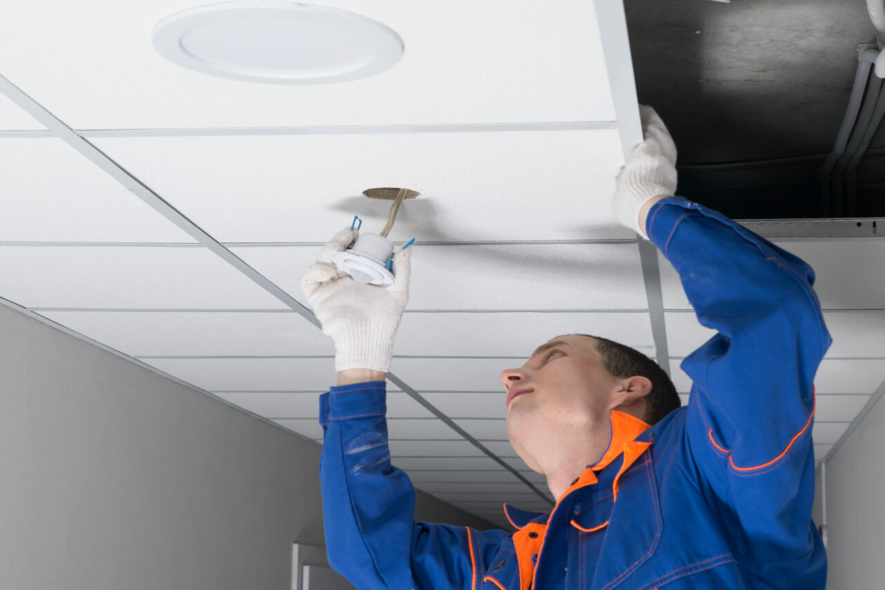 close-up of the installation of a motion sensor for lighting automation