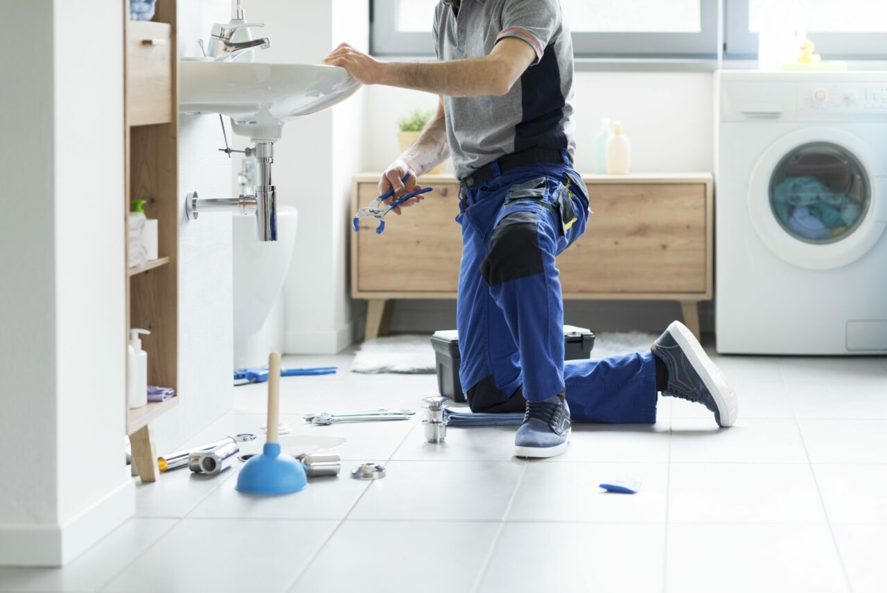 Professional-plumbing-service-plumber-fixing-a-bathroom-sink