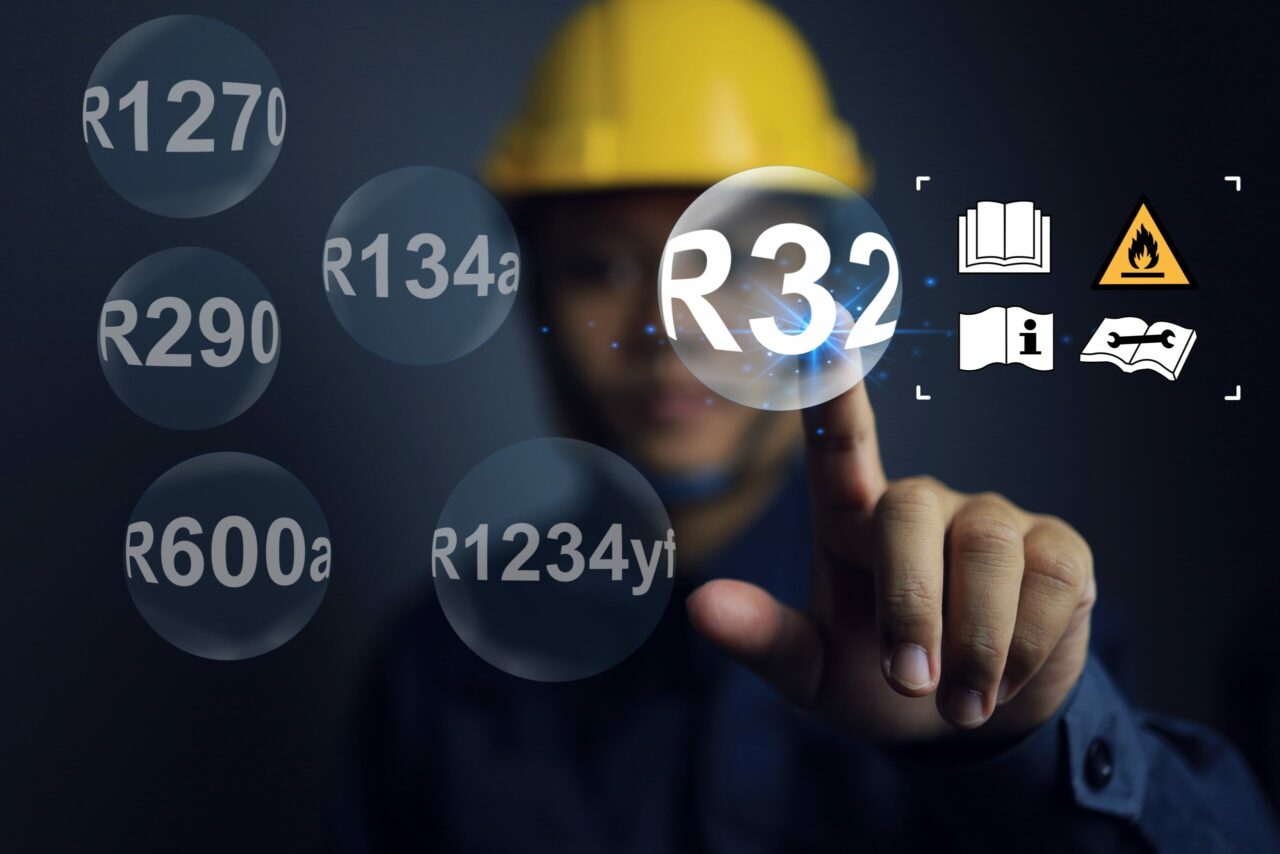 Safety Staff Pointing on R32 with Warning Sign