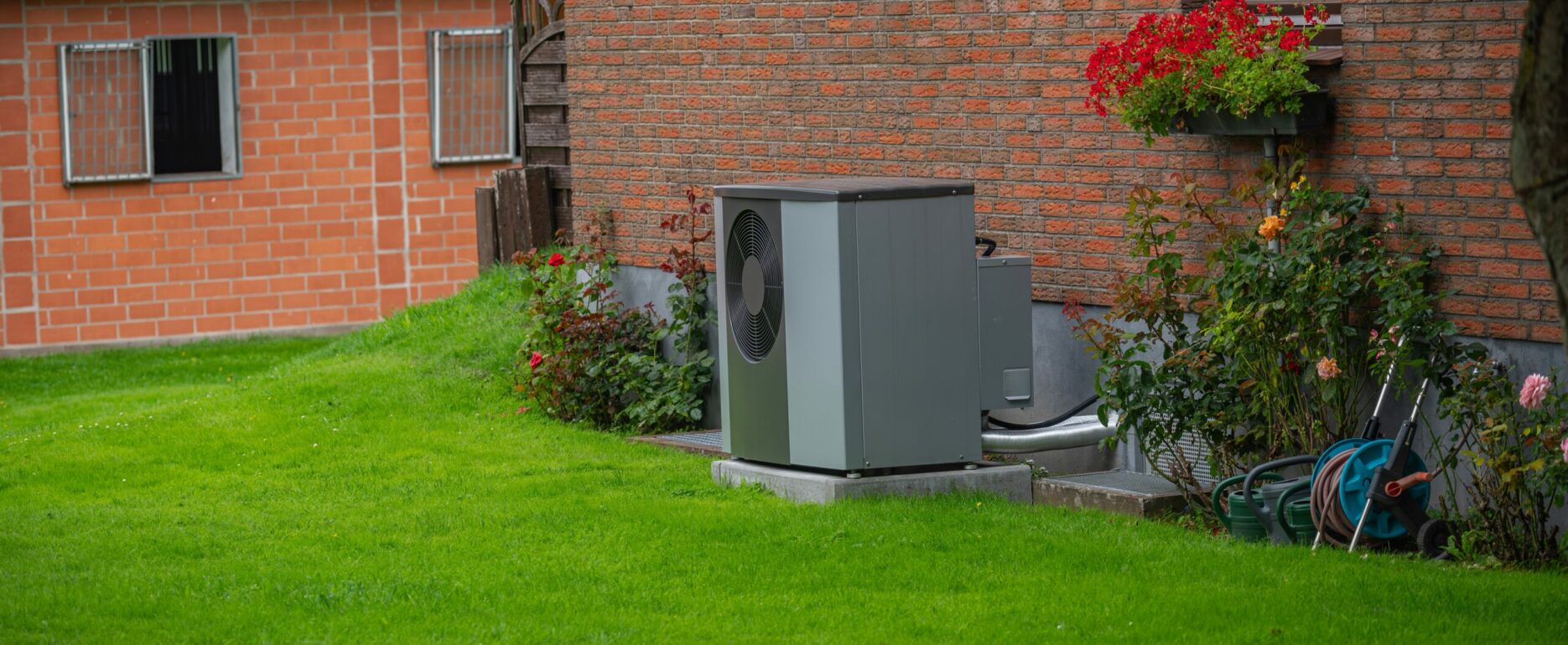 Air heat pump installed on the exterior facade of the old house