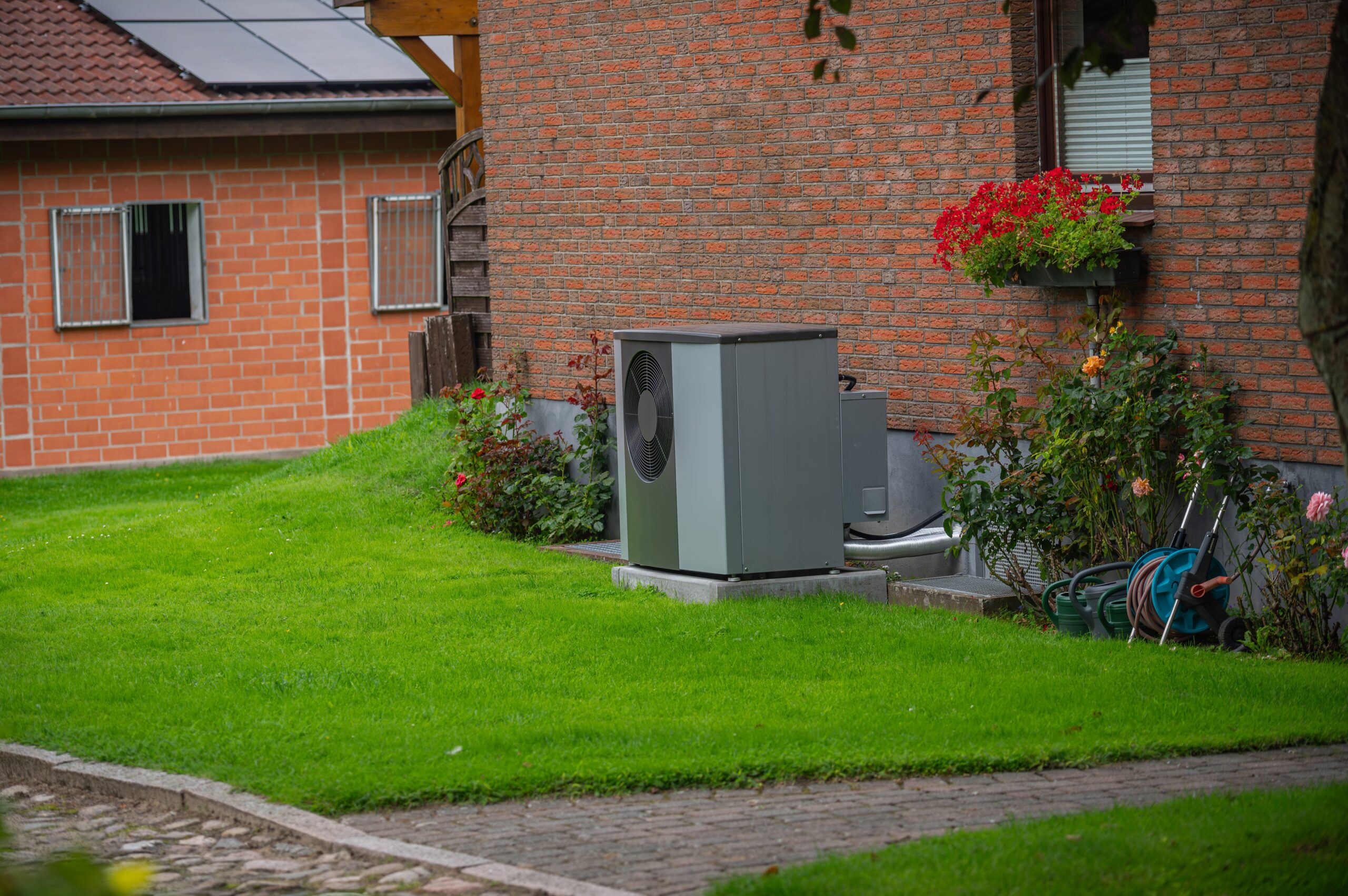 Air heat pump installed on the exterior facade of the old house