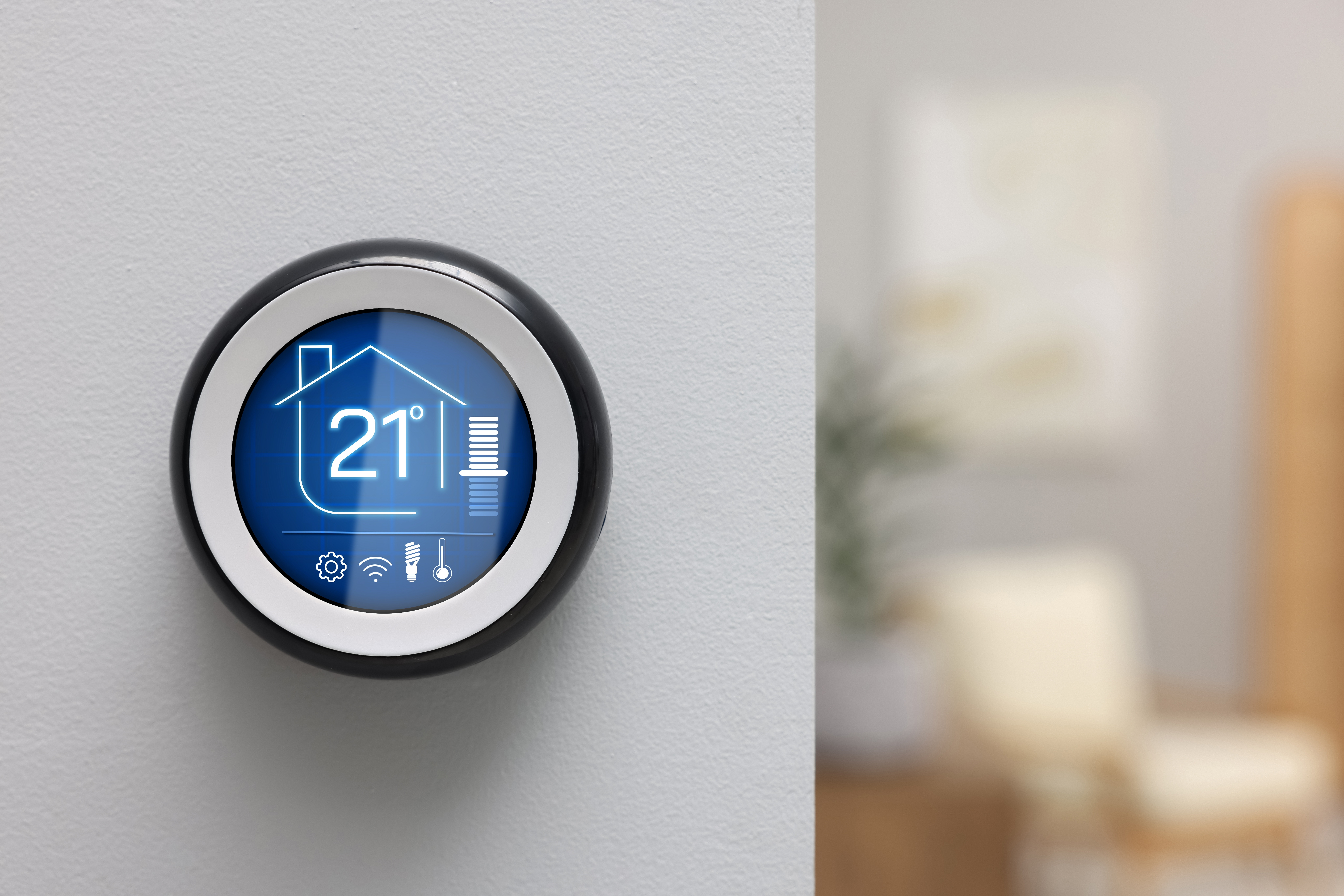 Thermostat displaying temperature in Celsius scale and different icons