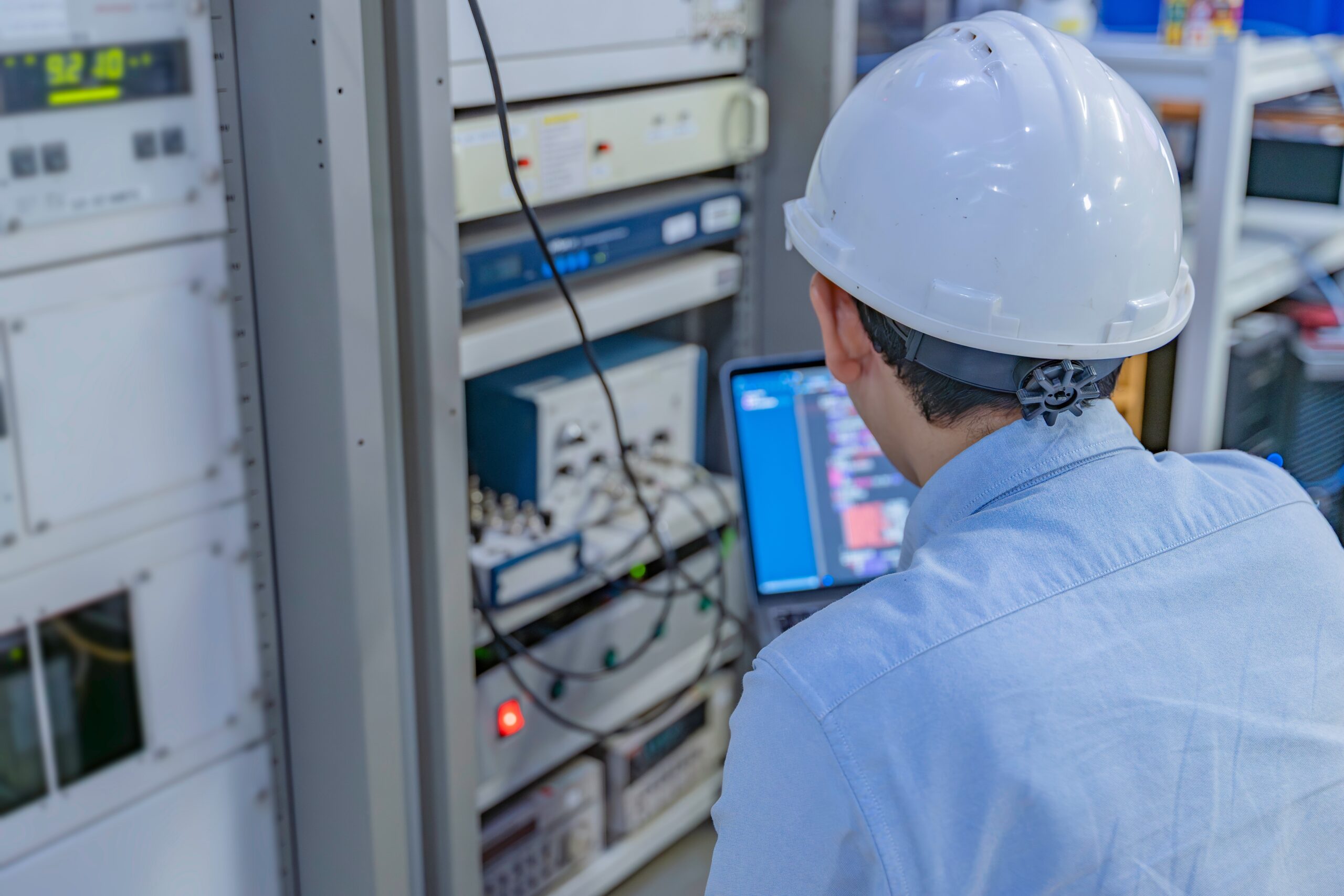 Electrical Engineer Male Checking Voltage At The Power Distribution Cabinet