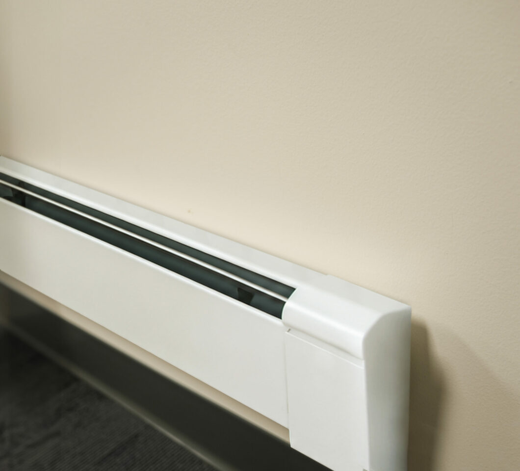 Fin-Tube Baseboard Heater Installed Along a Finished Wall.